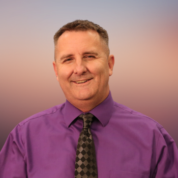 man with tie smiling